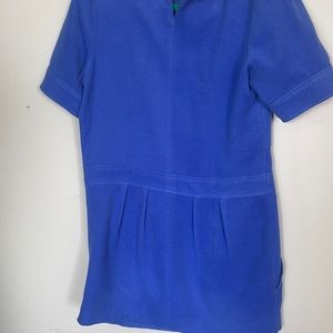 Six button dress with purple color and size 2 and two pockets used gently .